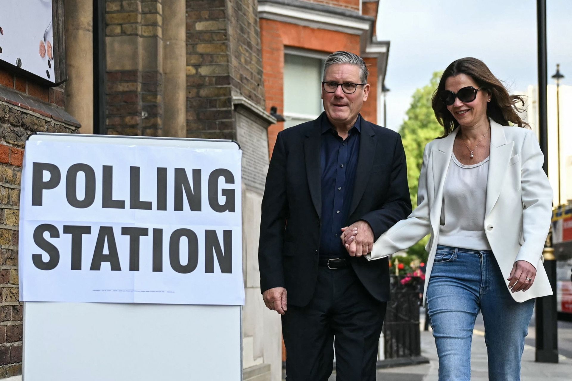 Prime Minister Sir Keir Starmer arrives with his wife Victoria to vote at a London polling station 