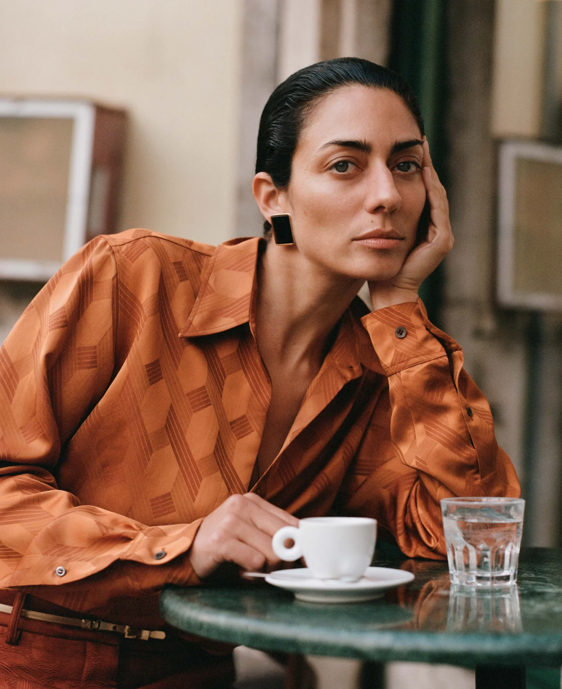 Dries Van Noten silk-mix shirt, €895, and textured jacquard trousers, €675. Loro Piana brass and enamel earrings, ￡585. Fendi brass belt, ￡810