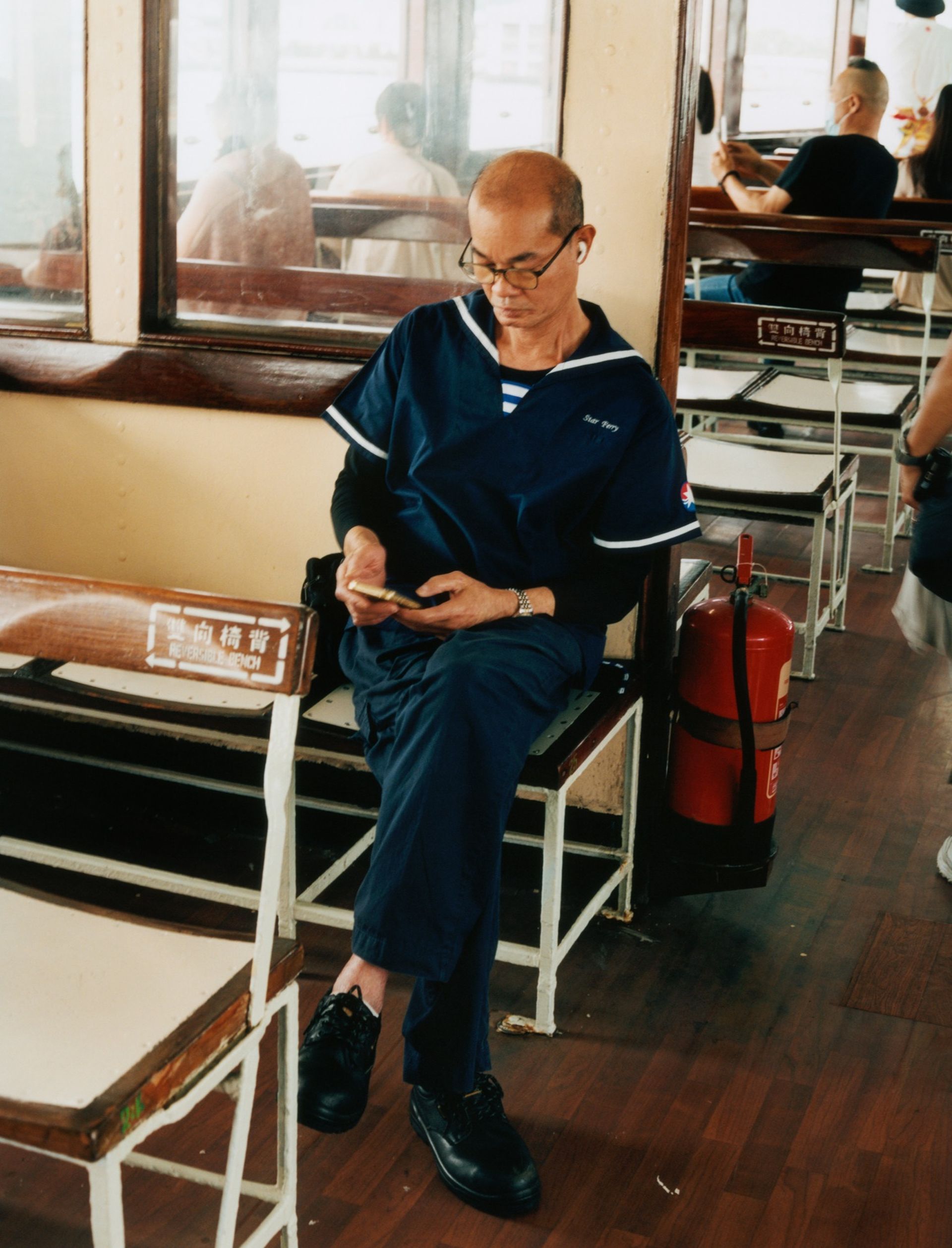 An employee on the Star Ferry that crosses Hong Kong's harbour