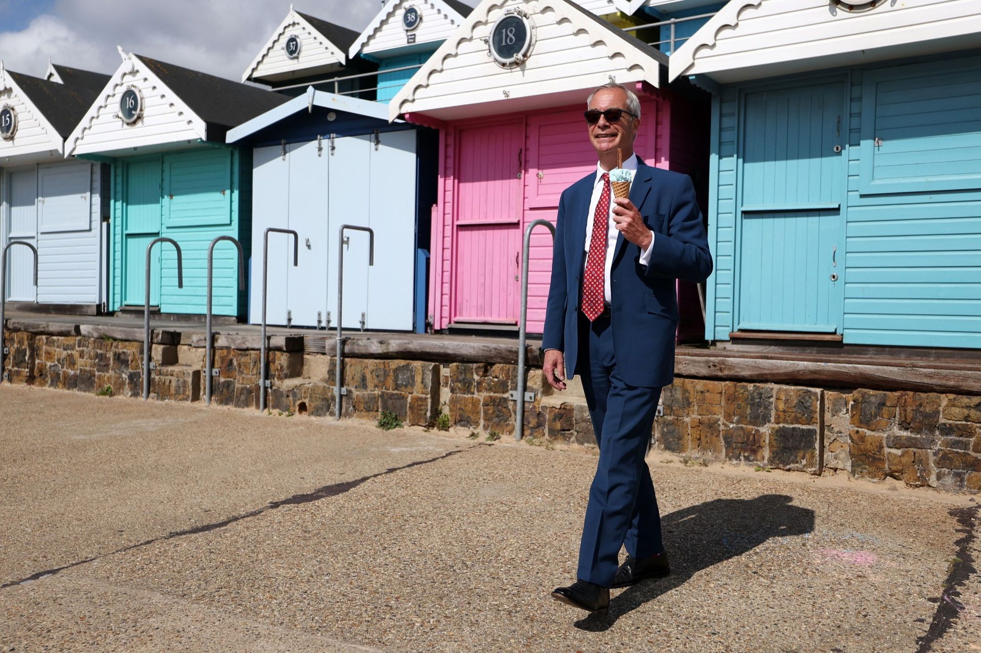 Reform UK leader Nigel Farage enjoys an ice cream after voting in Clacton-on-Sea, Essex